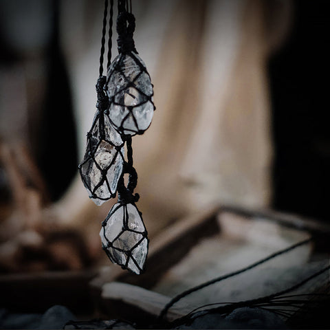 Natural clear quartz pendants with hand-wrapped cord for energy healing and mindfulness practices