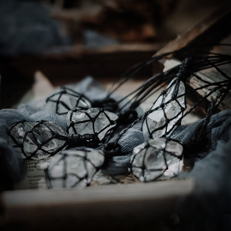 Natural clear quartz pendants with hand-wrapped cord for energy healing and mindfulness practices