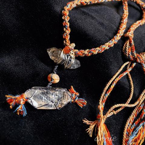 Close-up of braided white crystal necklace